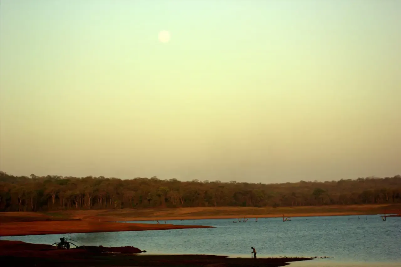 Sit at the Harangi Backwaters at Sunrise